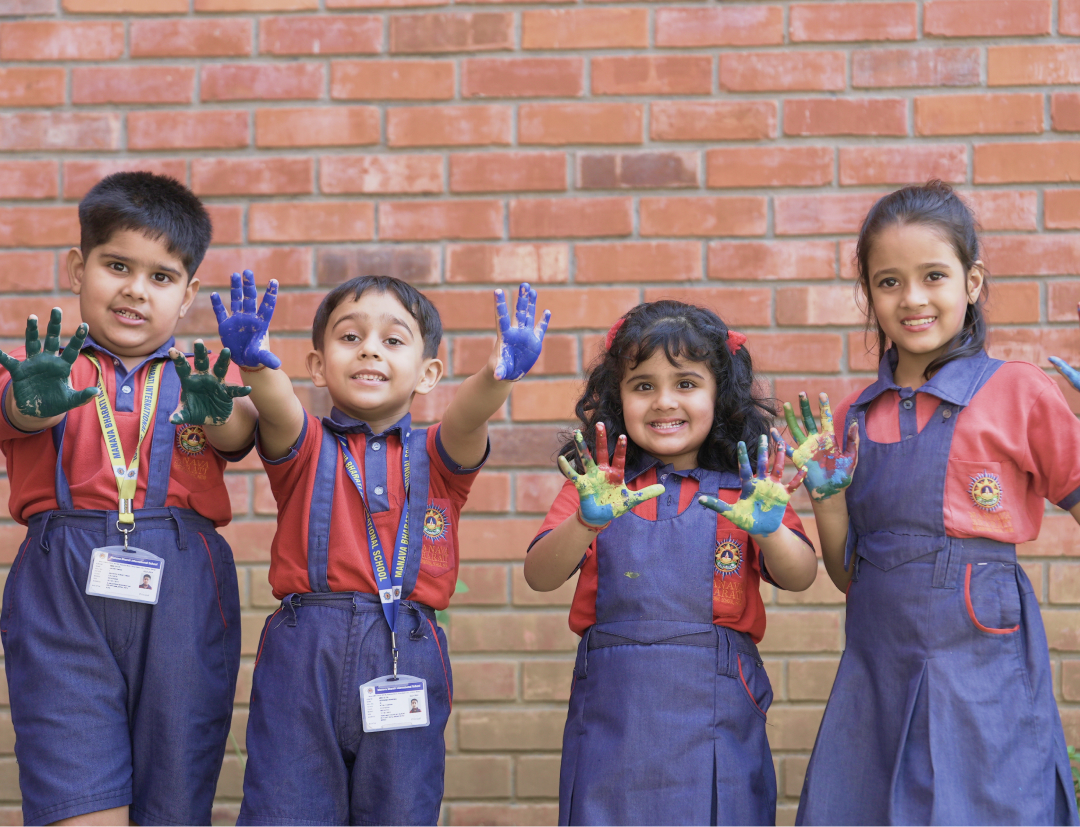 Smiling schoolers enjoying playful learning in MBIS Patna's Junior Wing
